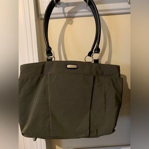 Baggallini tote with zippered trolley/rolling bag slip.